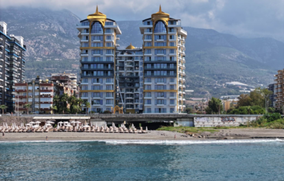 Luxuriöse 2-Zimmer-Wohnung direkt am Strand zum Verkauf in Mahmutlar Alanya 1